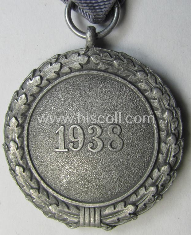 Neat, 'Luftschutz-Ehrenzeichen 2. Stufe' being a non-maker-marked example as executed in (light-weight) aluminium-based metal and that comes mounted onto its period (confectioned) ribbon ie. 'Bandabschnitt'