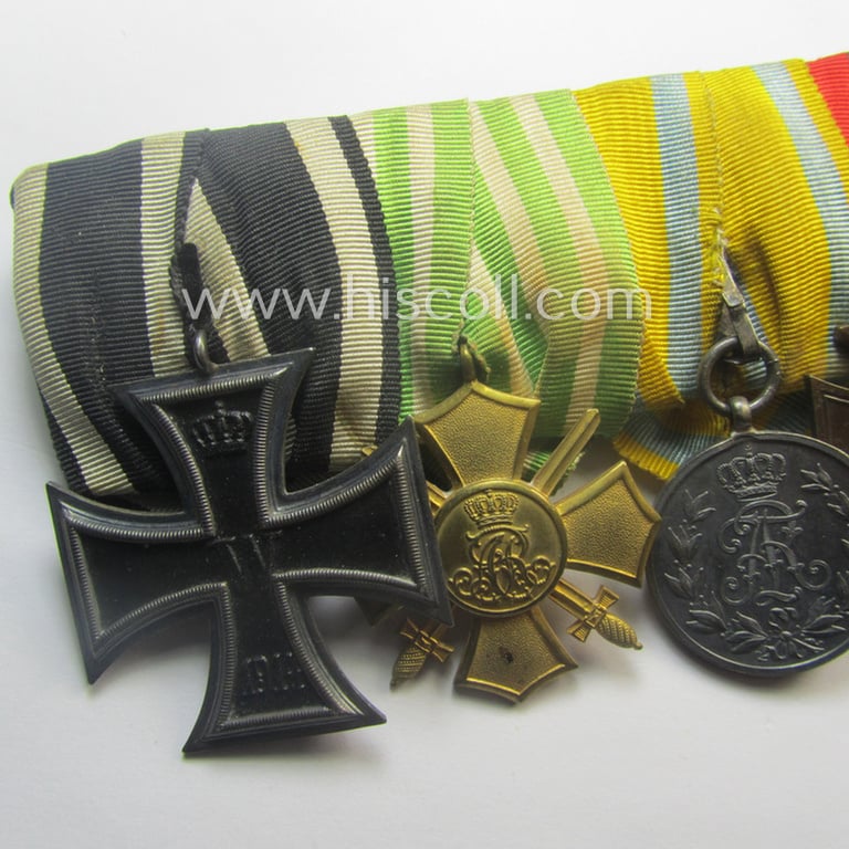 Three-pieced, (pre) 'WWI'-related medal-bar grouping (ie. 'Ordenspange-Satz') resp. depicting a WWI-period: 'EKII. Kl.', a: Sachs. 'Ehrenkreuz mit Schw.', a: 'Friedrich August Medaille in Silb.', a: 'FKK 1914-18' and an Austrian WWI-comm. medal