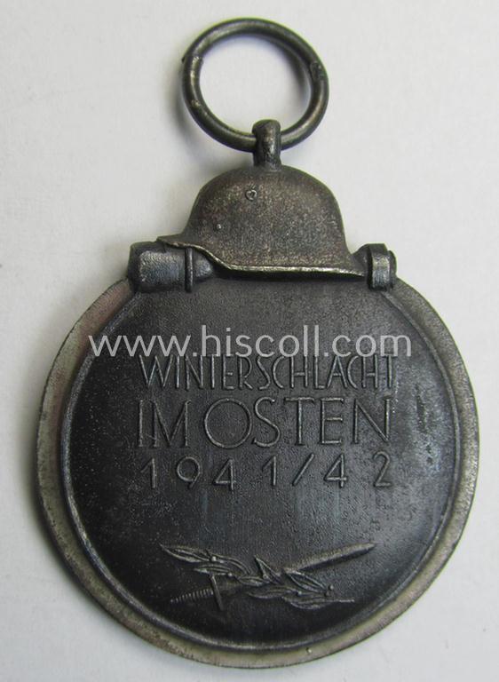 Attractive medal-set: 'Winterschlacht im Osten 1941-42' being a maker- (ie. '14'-) marked- (and/or 'Feinzink'-based) specimen by the maker: 'L.Chr. Lauer' and that comes together with its (minimally confectioned) ribbon (ie. 'Bandabschnitt'...