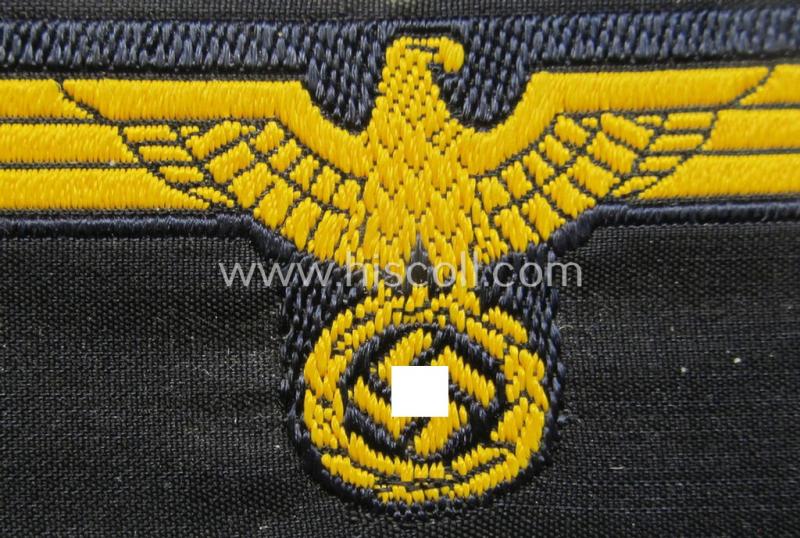 WH (Kriegsmarine) early- (ie. mid-war-) period- and/or golden-yellow-coloured WH (KM) type side-cap-eagle as executed in the neat 'BeVo'-weave pattern onto a darker-blue-coloured background