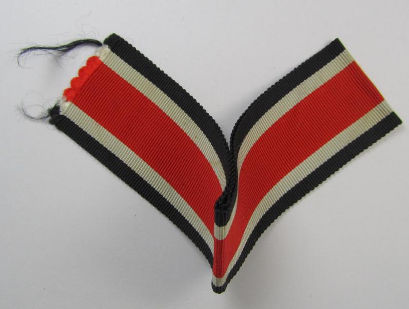 Neat spare-part: a non-confectioned- (ie. full length- ie. 29 cms. long-sized-) ribbon (ie. 'Bandabschitt') as was intended for the: 'Eisernes Kreuz II. Klasse' and that comes in an overall very nice- (ie. 'virtually mint ie. unissued'-), condi...