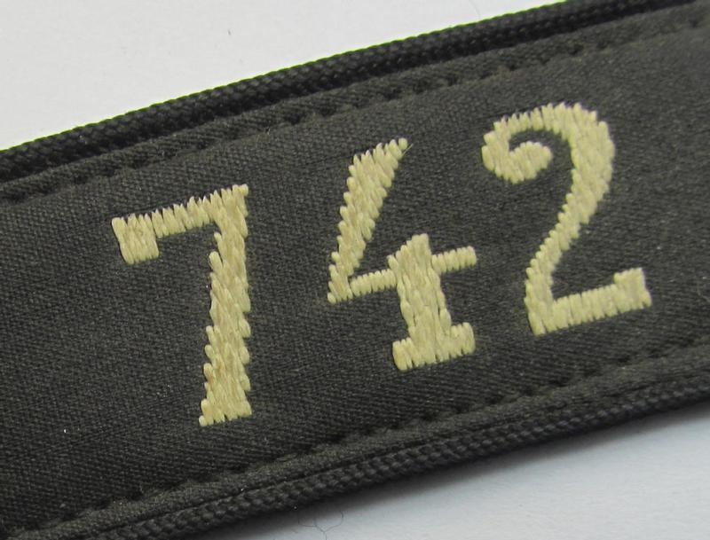 Neat - and naturally single! - black-piped 'DJ- o. Deutsches Jungvolk' shoulderstrap as was intended for usage by a: 'DJ-Mitglied' who served within the: 'Bann 742' (742 = 'Rappoltsweiler') and that comes with its period-attached 'RzM'-etik...