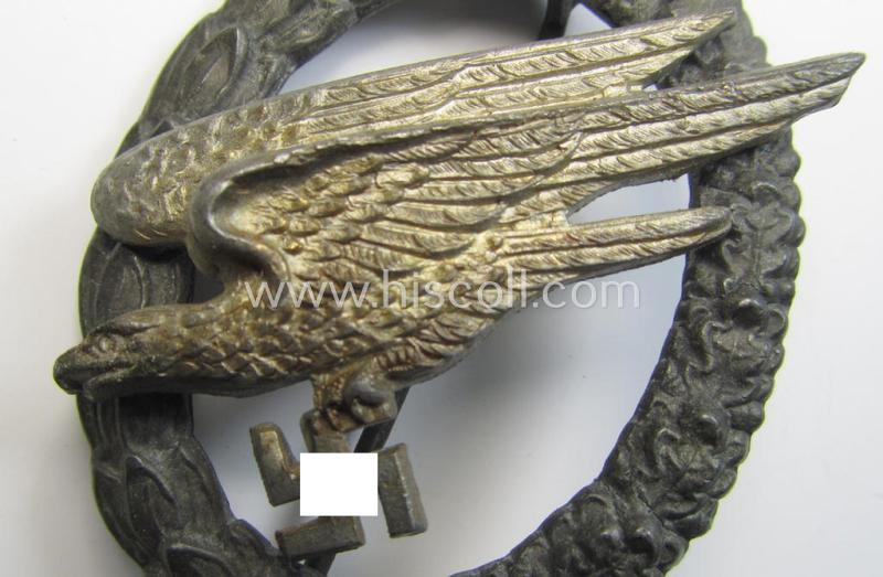 Attractive - and I deem mid- (ie. later-) war-period - zinc- (ie. 'Feinzink'-) based version of a WH (Luftwaffe) 'Fallschirmschützen-Abzeichen' (being a non-maker-marked, 'Type H'-pattern example as was produced by the: 'C.E. Juncker'-company...