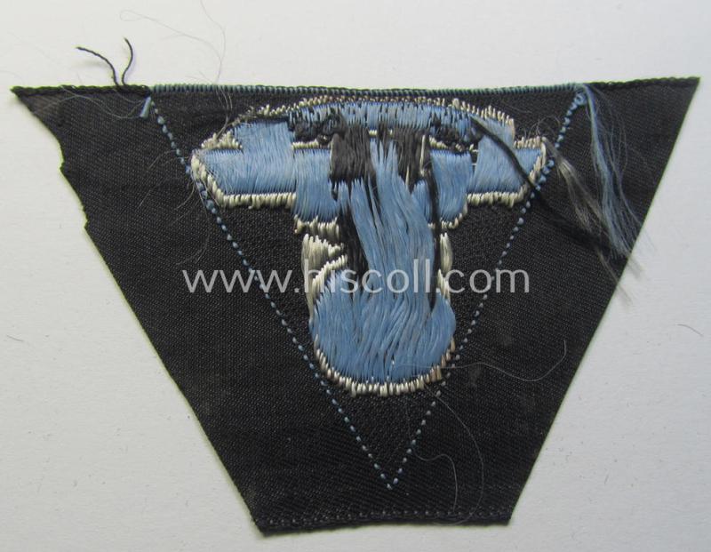 Attractive, so-called: N.S.K.K. (ie. 'National Socialistisches Kraftfahr Korps') side-cap-eagle (ie. 'Adler für N.S.K.K.-Schiffchen o. Lagermütze') being a 'flat-wire-woven'-example onto a bright-blue-coloured background