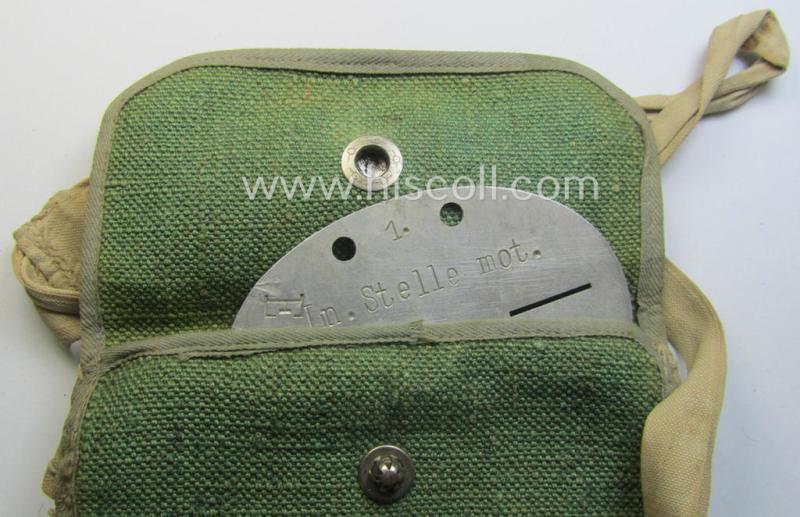 Aluminium-based WH (Luftwaffe) ie. 'Luftnachrichten'-related ID-disc (ie. 'Erkennungsmarke') bearing the stamped unit-designation that reads: 'Ln.Stelle mot - E63' and that comes stored in its period (linnen-based) pouch