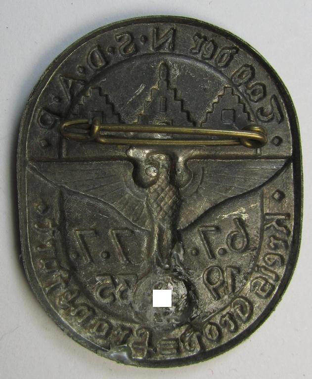 Commemorative, tin-based- and/or: golden-bronze-toned N.S.D.A.P.-related 'tinnie' showing a detailed eagle-device and towns'-scene with below that the text: 'Tag der N.S.D.A.P. - Kreis Gross-Frankfurt - 6.7/7.7. 1935'