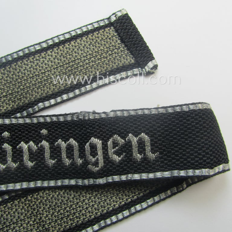 Stunning, 'SS-Totenkopfverbände'-officers'-type, 1937-pattern cuff-title (ie. 'Ärmelstreifen') as executed in flat-wire 'BeVo'-weave-pattern (in Gothic-styled script) for an officer within the: 'SS-Totenkopf Standarte' “Thüringen”