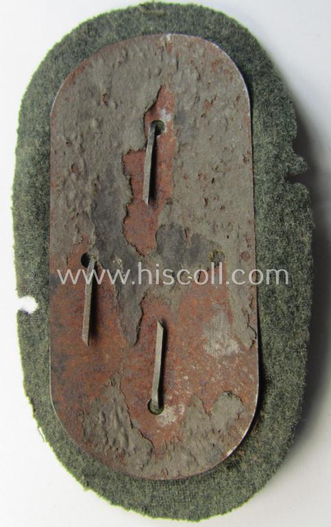 WH (Heeres ie. Waffen-SS) 'Demjansk'-campaign-shield as executed in typical magnetic metal (ie. so-called: 'Eisenblech') and that comes in an overall very nice- ie. fully untouched, condition