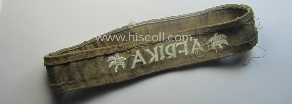 Cleary worn WH cuff-title (ie. 'Ärmelstreifen') entitled: 'Afrika' (being a minimally shortened example that comes in an overall very nice- (ie. issued and clearly worn ie. once tunic-attached-), condition