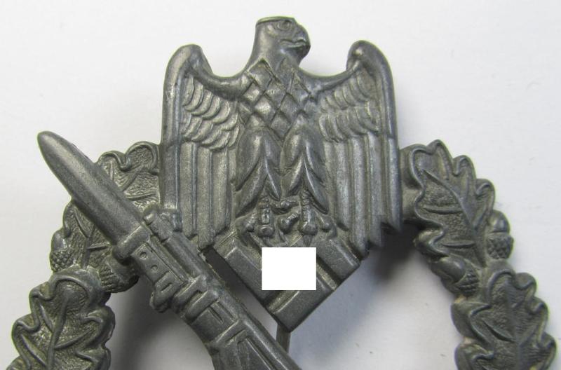Attractive - and moderately used! - 'Infanterie-Sturmabzeichen in Silber' (or: silver-class infantry-assault badge ie. IAB) being a neatly maker- (ie. 'MK 1'- or: 'Metall u. Kunststoff'-) marked example as executed in silverish-coloured 'Feinz...