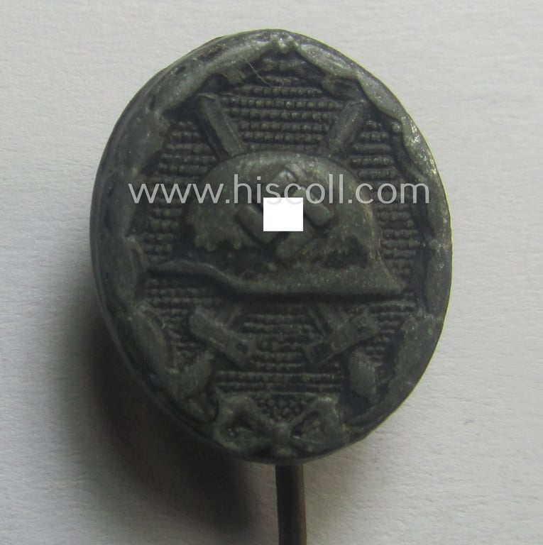 Neat - and 17 mm. sized! - miniature lapel-pin (ie. 'Halbminiatur') depicting a: 'Verwundeten-Abzeichen in Schwarz' (or: black-class wound-badge) being a non-maker-marked example