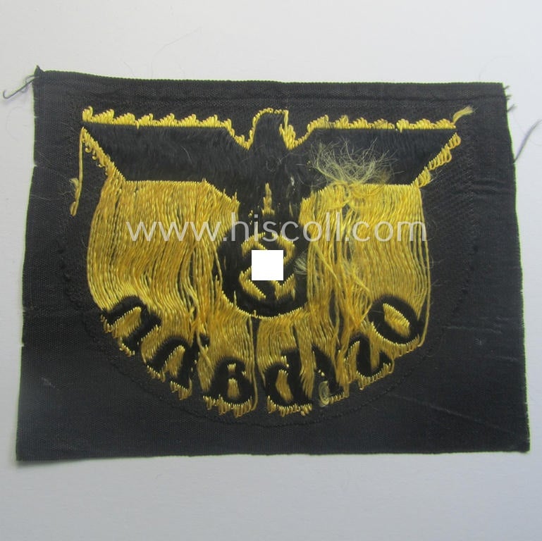 RB- ('Reichsbahn'-) related arm-eagle (ie. 'Ärmeladler') depicting the text: 'Ostbahn' (as was presumably intended for an official of the: 'Deutsche Reichsbahn' ie. the: 'WVD im Osten' ie.: 'Wehrmacht-Verkehrsdirektion im Osten')