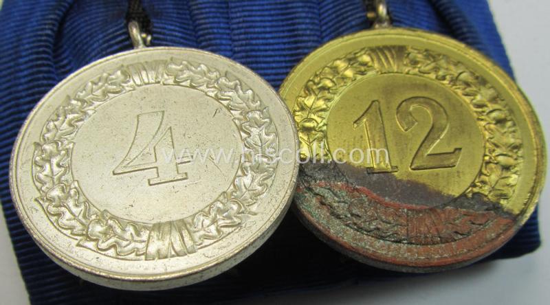 Superb, two-pieced medal-bar (ie. 'Spange') showing two: WH (Luftwaffe) so-called: 'Dienstauszeichnungen für 4 u. 12 Jahre Treue Dienste' that both come period-mounted as a so-called: 'Doppelspange'