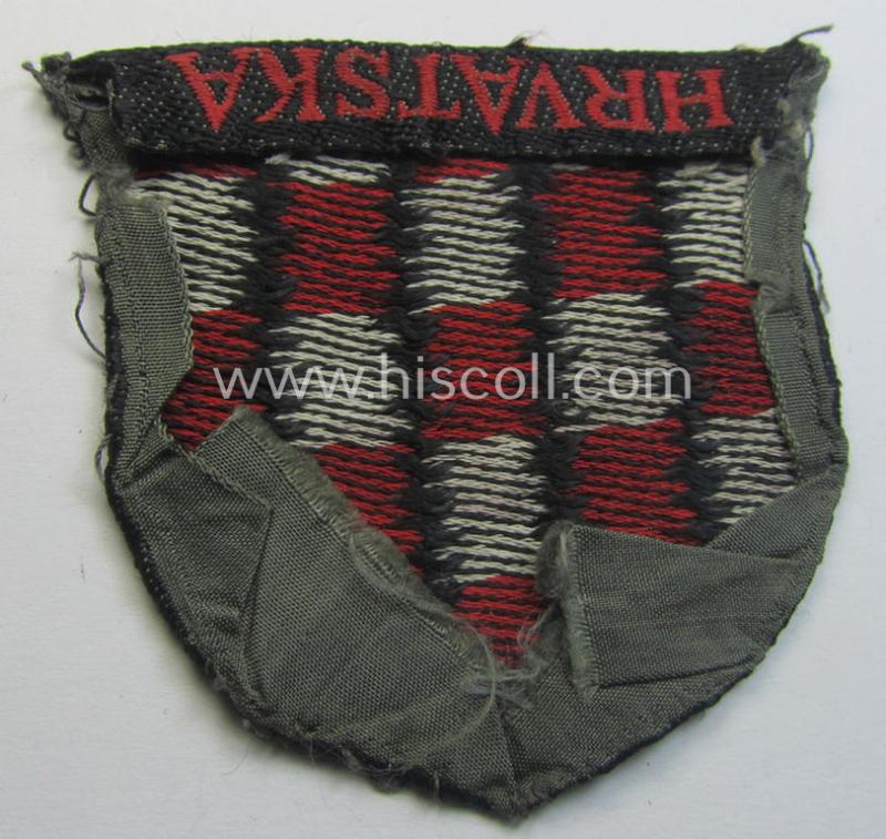 Truly used- and/or worn, multi-coloured- and/or 'BeVo'-woven armshield (ie. 'Ärmelschild') entitled: 'Hrvatska' as was intended for usage by a volunteer who served within the 'Deutsche Wehrmacht' ie. within the 'Kroatische Legion'