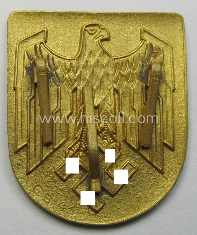 Superb, WH (KM) tropical- (ie. 'DAK'- or: 'Deutsches Afrikakorps'-) related- and/or zinc-based, eagle-'pith-helmet'-shield being a maker- (ie. 'G.B.-41'-) marked example that comes in a very nice- (ie. 'virtually mint- ie. unissued'-), cond...