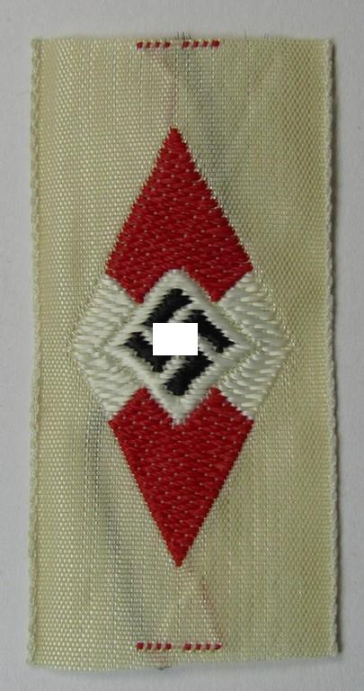 Neat, HJ (ie. 'Hitlerjugend') cap-badge (ie.: 'Raute') being a bright-red-coloured- and/or detailed example that is executed in the neat 'BeVo'-weave-pattern