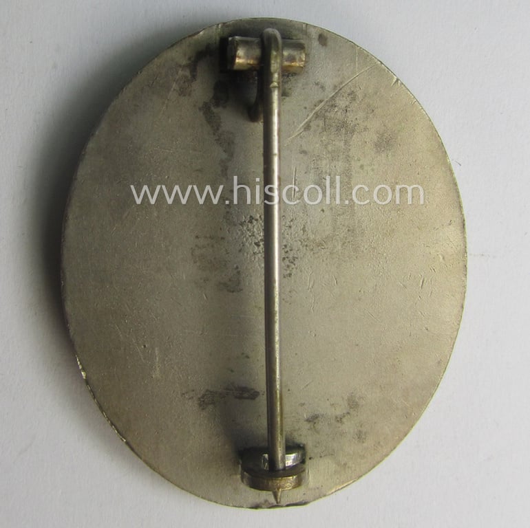 Silver-class wound-badge- (or: 'Verwundeten-Abzeichen in Silber'-) set comprising of a non-maker-marked example as produced by an unidentified 'Hersteller' and that comes stored in its typical 'LDO'-styled etui