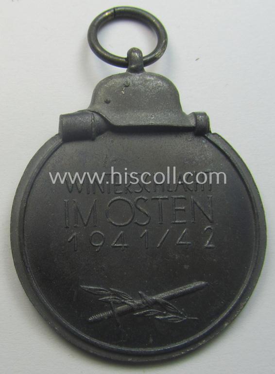 Neatly maker- (ie. '19'-) marked medal: 'Winterschlacht im Osten 1941/42' that came stored in its period pouch by the company: 'E. Ferd. Wiedmann'