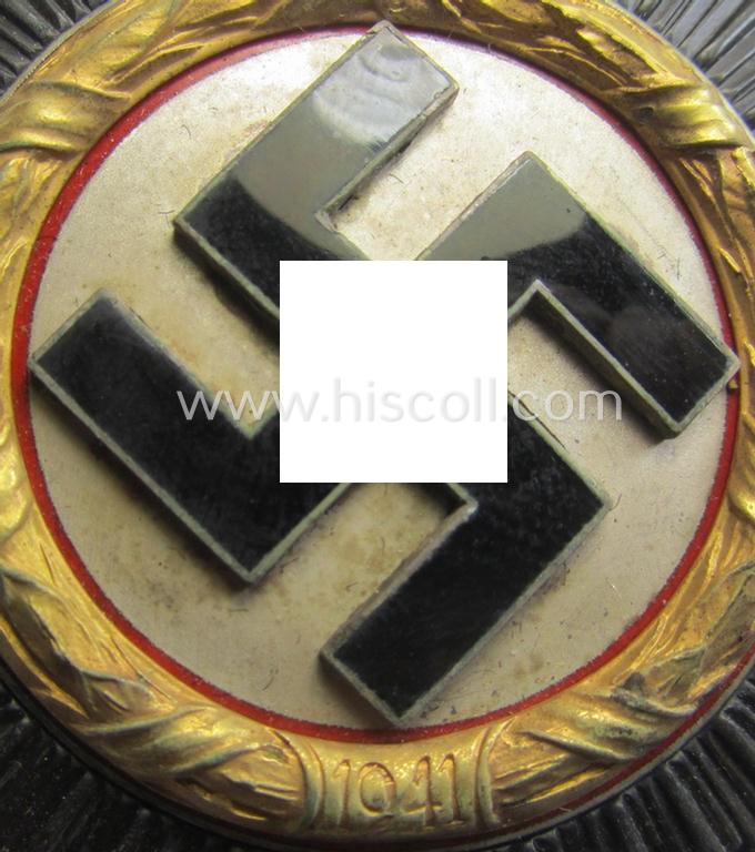 Stunning, maker- (ie. '20'-marked-) example of WH (Heeres, LW etc.) 'Deutsches Kreuz im Gold' (or DKiG) being a (regular- ie. 'light-weight') piece that was produced by the: 'C.F. Zimmermann'-company and that comes stored in its period etui