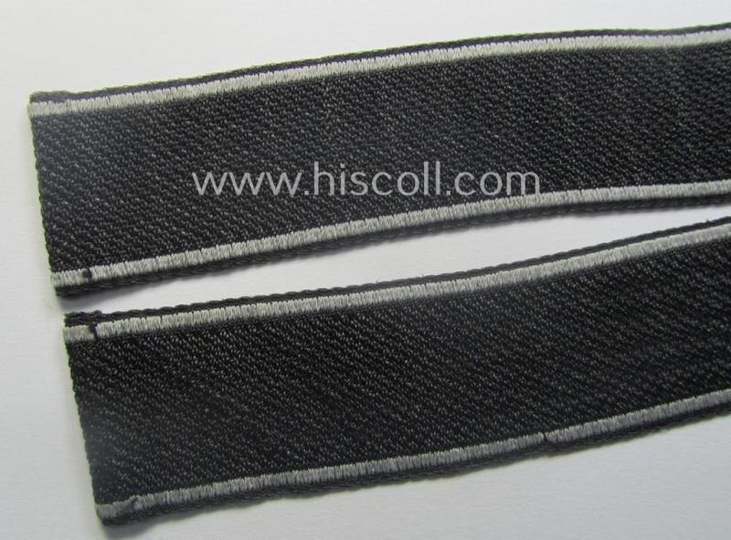 Waffen-SS, 1943-pattern cuff-title (ie. 'Ärmelstreifen') depicting the machine-woven Latin script text in silver-grey linnen as was intended for a member of the: 'SS-Geb.Jäg.-Rgts. 6. (u.11.)': "Reinhard Heydrich"