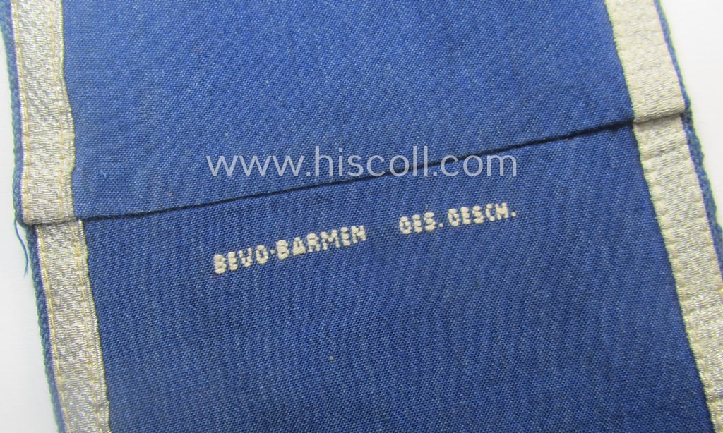 Darker-blue-coloured, RLB (or: 'Reichsluftschutzbund') so-called: 'Amtsträger-Armbinde für Führer' depicting the typical 'RLB'-logo (with lettering) and that comes in a just moderately used- ie. worn, condition