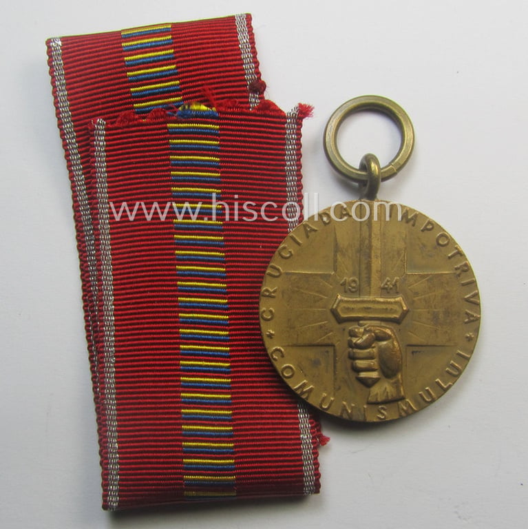 Romanian medal: 'Kreuzzug gegen den Kommunismus' (or in Romanian language: 'Medalia - Crusiada Impotriva Communismului') that comes together with its original (and never confectioned- ie. 'virtually mint') ribbon as issued