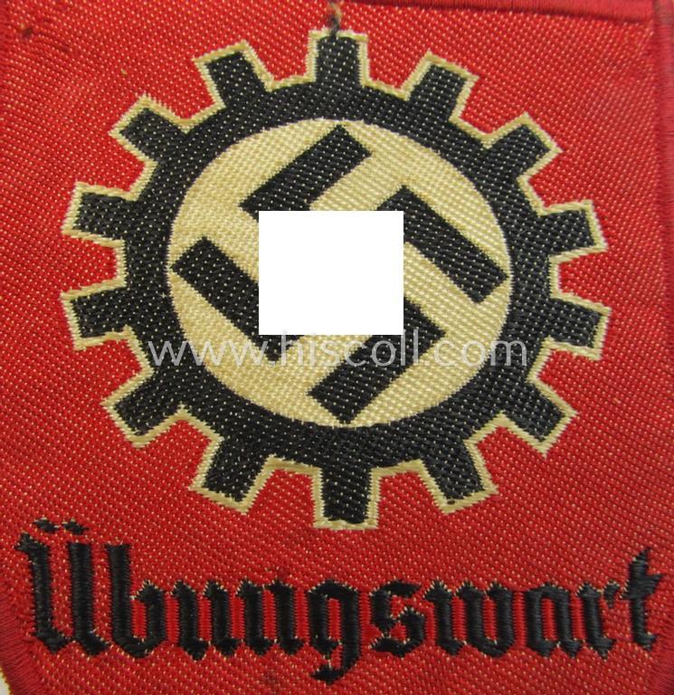 Attractive - and actually scarcely encountered! - D.A.F.- (ie. 'Deutsches Arbeitsfront') specialist-armbadge (ie. 'Tätigkeitsabzeichen') as executed in neat 'BeVo'-weave pattern, as was intended for a: 'D.A.F.-Übungswart'