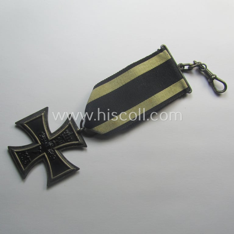 WWI-period: 'Eisernes Kreuz II. Klasse' being a typical maker- (ie. 'K.A.G.'-) marked example that comes mounted onto an unusually confectioned ribbon
