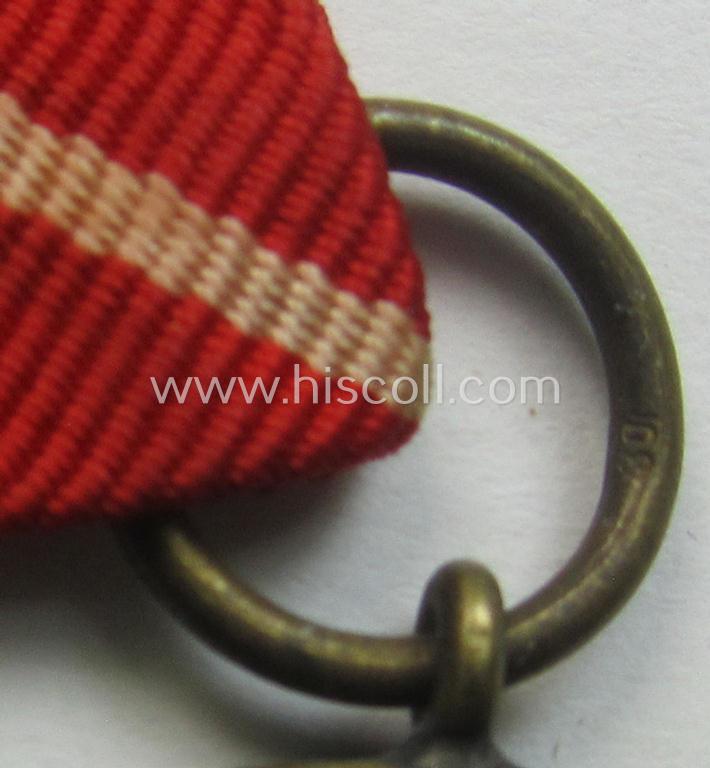 'Deutsche Bronzene Verdienstmedaille des Deutschen Adler Ordens ohne Schwn.' being a '30'-marked example