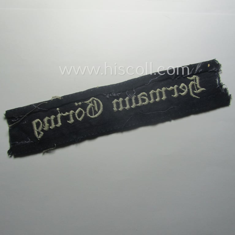 Truly used and typical 'smooth-woolen'-based, EM- (ie. NCO-) pattern WH (Luftwaffe) cuff-title (ie. 'Ärmelstreifen') entitled: 'Hermann Göring' that comes in a period-shortened and worn condition