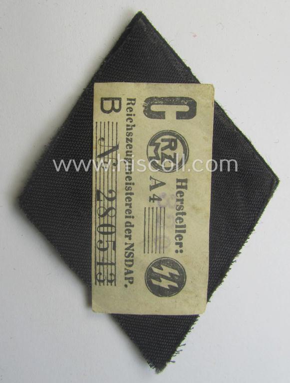 'SS'-related sleeve-diamond (ie.: 'Ärmelraute o. Schiessauszeichnung der 1. Stufe für Scharfschützen') being a very detailed- and hand-embroidered example that still retains its period, paper-based: 'RzM-Etiket'