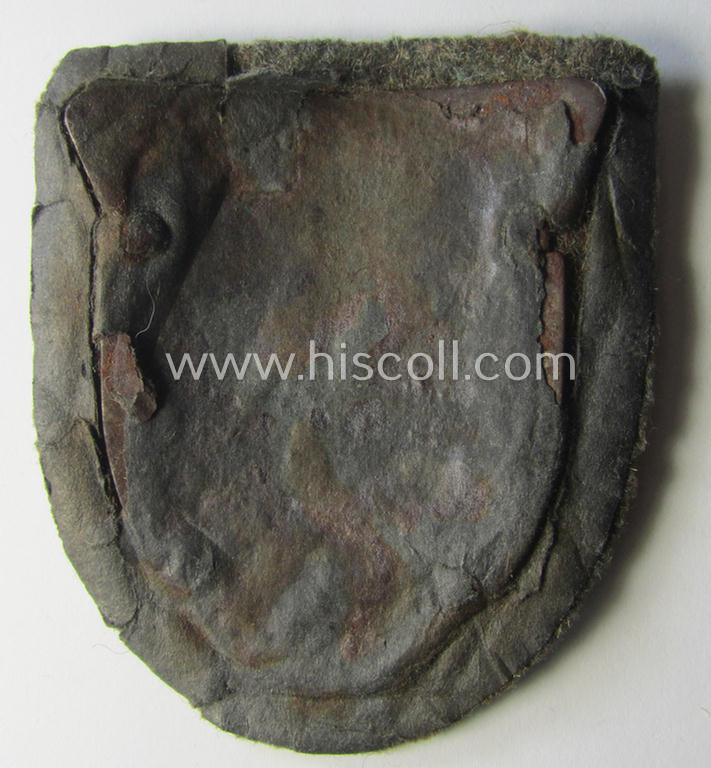 Attractive - truly worn and actually scarcely encountered! - WH (Heeres ie. Waffen-SS) 'Kuban'-campaign-shield that comes mounted onto its original field-grey-coloured- and/or woolen-based 'backing' as issued and/or used
