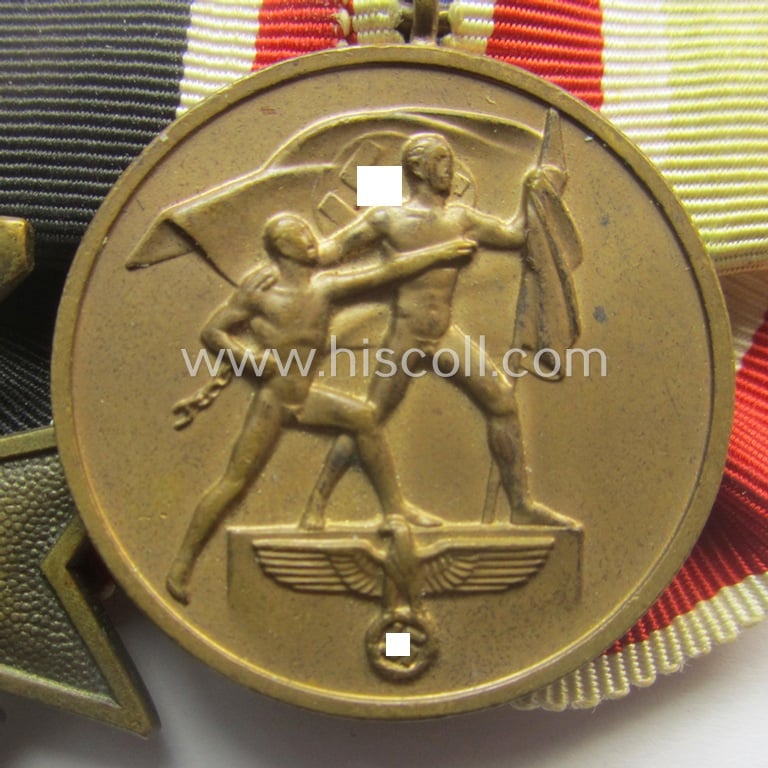 Superb example of a 2-pieced medal-bar (ie.: 'Orden- o. Doppelspange') resp. showing a: 'KvK 2. Klasse mit Schw.' and a WH Memelland 'Anschluss'-medal: '22 März 1939' (being of the so-called: 'slanted G'-type)