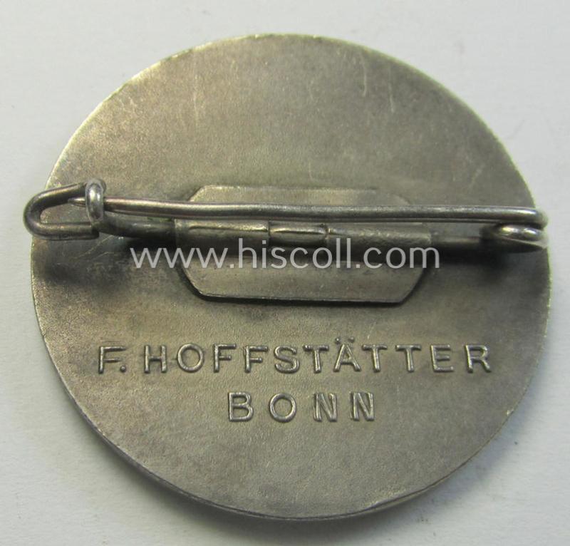 Superb - and never before seen! - so-called: N.S.V. (ie. 'Nat.Soc.Volkswohlfahrt') membership-lapel-pin being a maker- (ie. 'Hoffstätter - Bonn'-) marked example depicting the text: 'Volksplegerin der NSV'