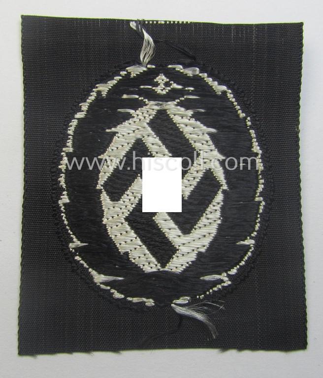 EM- (ie. NCO-) type, so-called: 'Schutzmannschaften' (or: 'Schuma') cap-badge as executed in greyish-coloured thread onto a black-coloured- (ie. 'SS-Polizei'- ie. 'SD'-related-) background