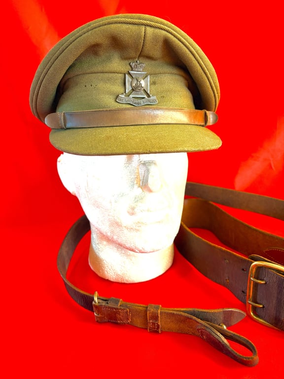 BRITISH WWII WILTSHIRE REGIMENT OFFICERS VISOR CAP, BELT AND CROSS STRAPS.