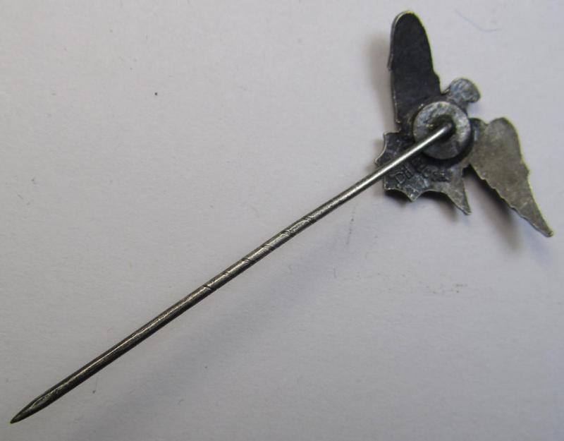 Semi-enamelled RLB- (ie. 'Reichluftschützbund') 'Amtsträger-Abzeichen' ie.: civil-attire badge (of the second pattern) being a maker- (ie. 'HA'-) marked example that is additionally bearing a patent-pending- (ie. 'Ges.Gesch.'-) marking on its...