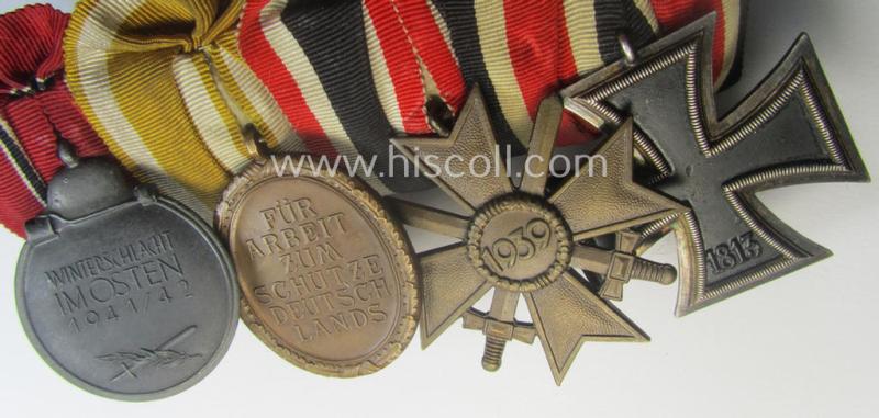4-pieced, WWII-period medal-bar (ie. 'Ordenspange') showing resp. an: 'EKII.Kl.', a: 'KvKII.Kl. m. Schw.', a: 'Westwall'-medal and a: 'Medaille Winterschlacht im Osten 1941-42'