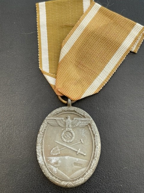 WWII GERMAN WEST WALL MEDAL WITH PAPER ISSUE PACKET.