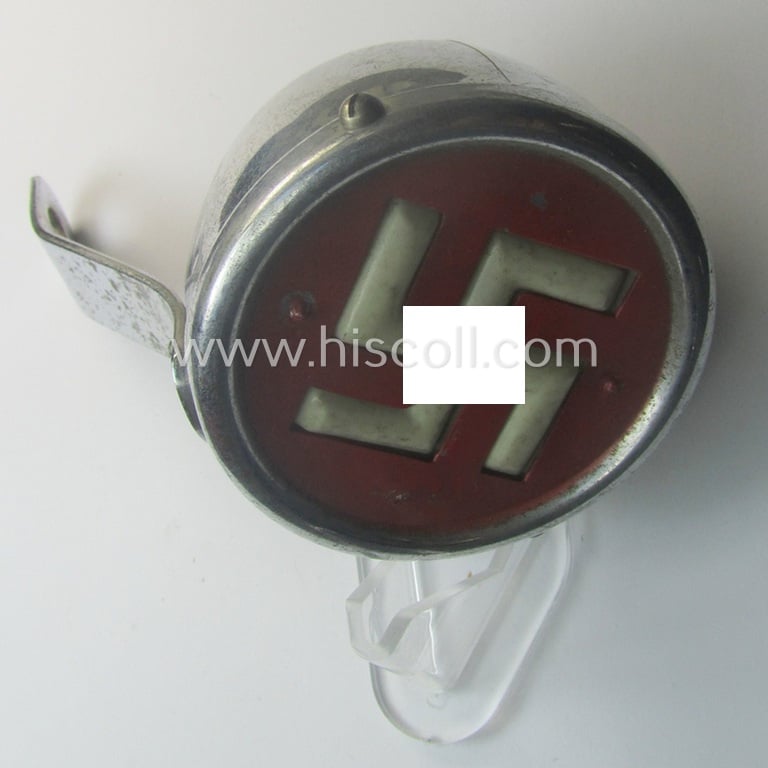 Very unusual - and never before seen! - TR-era 'Nazi-Kitsch'-item: a chromed-metal-based bicycle- (or: motor-cycle-) tail-light showing a white swastika onto a red-coloured and semi-transparant background