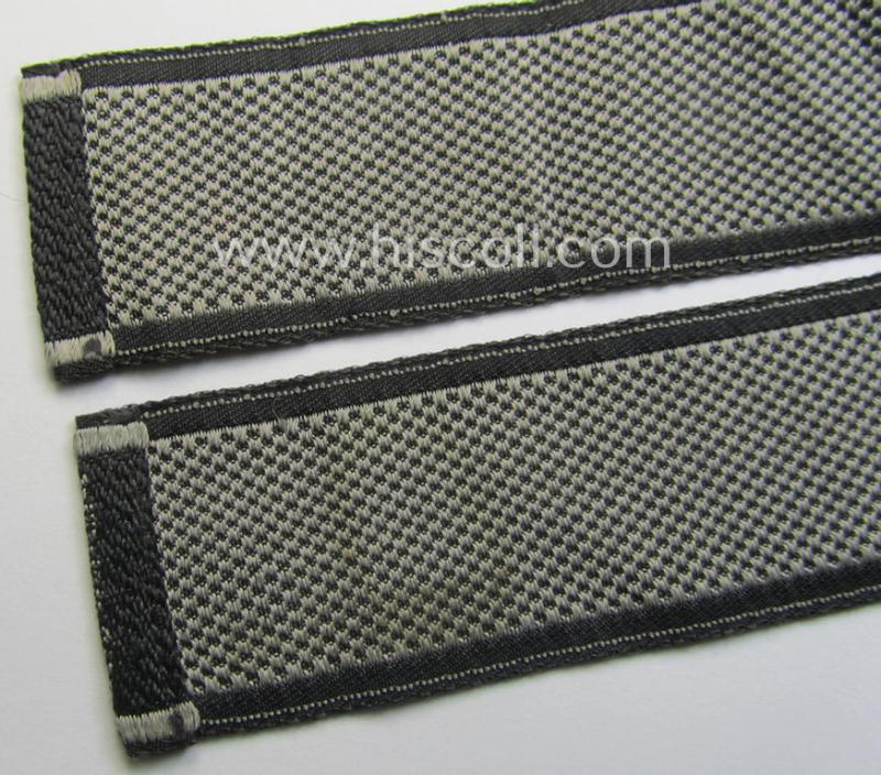 Waffen-SS, 1943-pattern cuff-title (ie. 'Ärmelstreifen') depicting the machine-woven Latin script text in silver-grey linnen as was specifically intended for usage by a member of the: 'SS-Regiment “Der Führer”