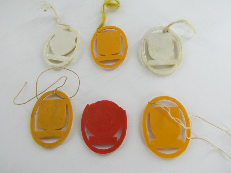 Winterhilfswerk (WHW) plastic shields of different cities of Europe.