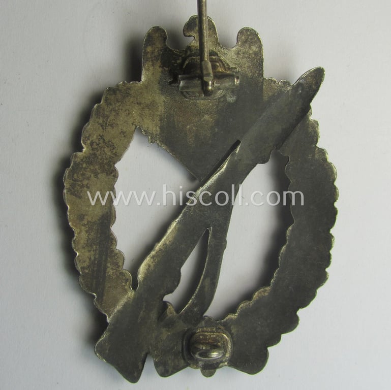 'Infanterie Sturmabzeichen in Silber' being a non-maker-marked and/or typical zinc- (ie. 'Feinzink'-) based version as was (I deem) procuded by the: 'Frank & Reif'-company