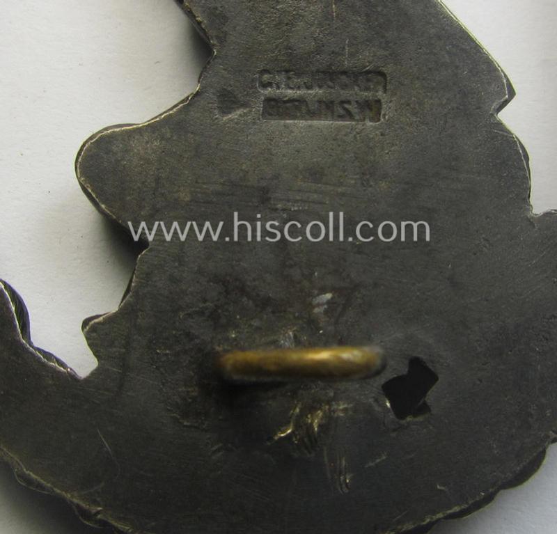 WH (Luftwaffe) 'Flakkampfabzeichen' being a detailed 'Buntmetall'-based and clearly maker-marked example as was produced by the: 'C.E. Juncker'-company and that comes as moderately worn