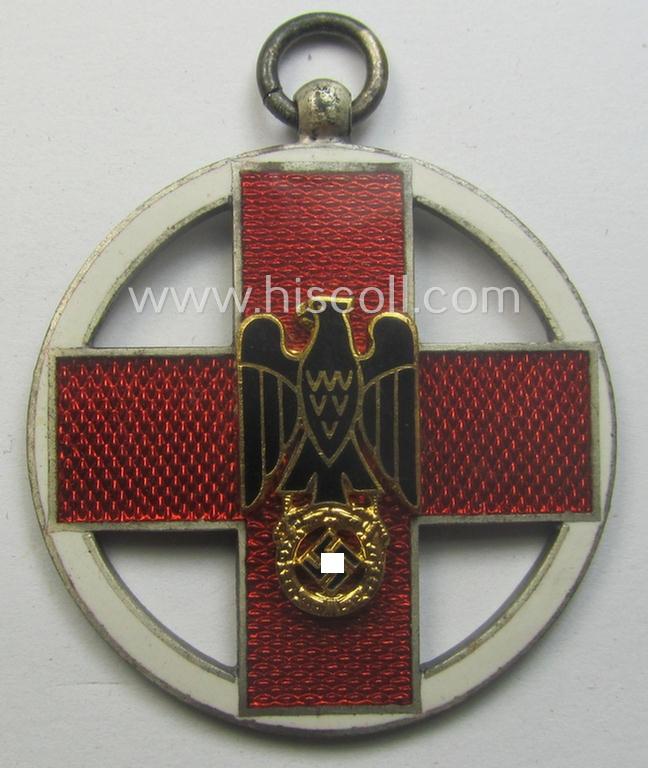 Superb, 'DRK-Ehrenzeichen des 3. Modell' that comes together with its original (regular-sized- and once-mounted) ribbon (ie. 'Bandabschnitt') as issued and/or stored for decades