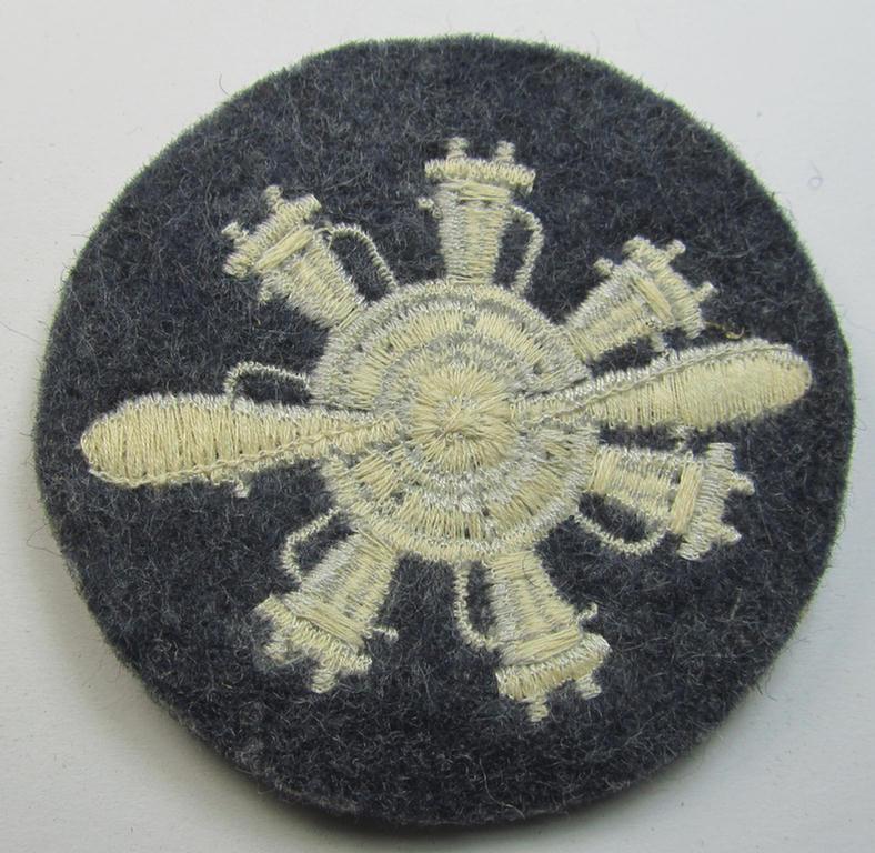 Machine-embroidered, WH (Luftwaffe) trade- ie. special-career-patch (ie. 'Laufbahn- o. Tätigkeitsabzeichen') as was specifically intended for a: 'Geräteverwalter (Flzg.)' and that comes in a 'virtually mint' and/or never tunic-attached, conditi...