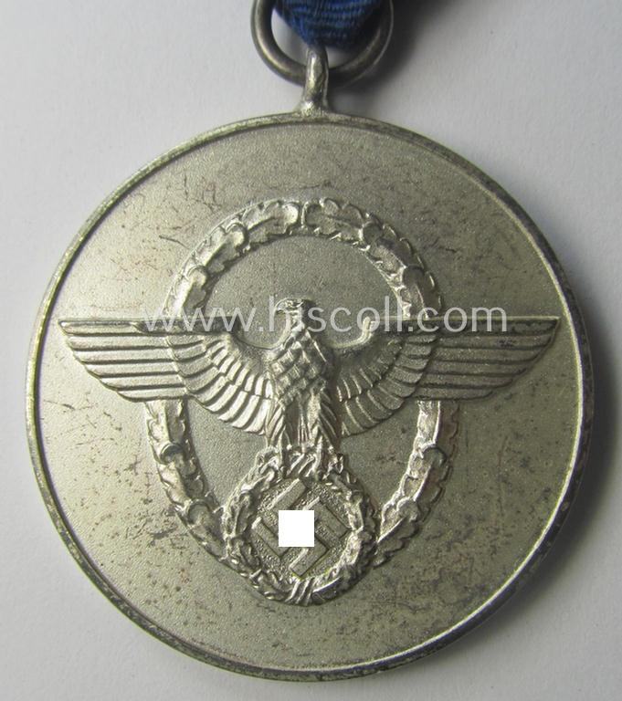 Bright-silver-toned so-called: 'Polizei-Dienstauszeichnung 3. Stufe' (or: police loyal-service medal 3rd class) that comes mounted onto its period ribbon (ie. 'Bandabschnitt')
