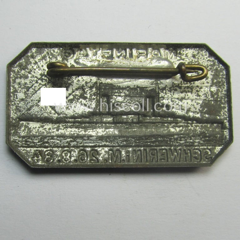 Commemorative, WH (Kriegsmarine) related 'tinnie' (ie. 'Tagungs- o. Veranstaltungsabzeichen'-) being a non-maker-marked example showing a cruiser and swastika-sunburst coupled with the text: 'Marinetag - Schwerin i.M. - 26-8-34'