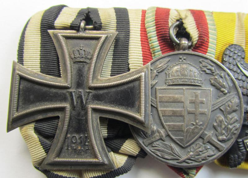 Attractive, 4-pieced medal-bar (ie. 'Ordenspange') respectively depicting a WWI-period: 'EK II. Klasse', an: Austrian/Hungarian WWI commemorative medal, a: 'Schlesisches Bewährungsabz. der II. Kl.'  and a: 'FKK 1914-18 m. Schw.'