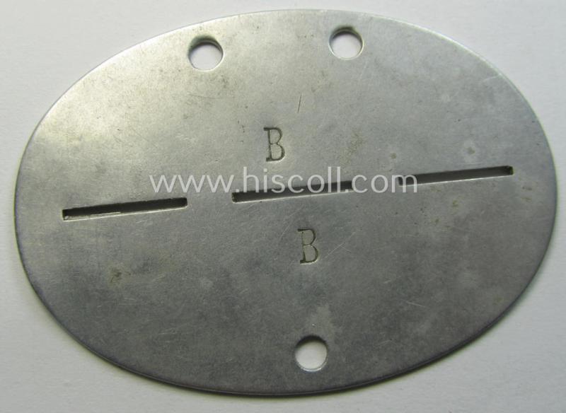 Aluminium-based, WH (Heeres-) ie. 'Gebirgsjäger o. Nachrichten'-related ID-disc (ie. 'Erkennungsmarke') bearing the clearly stamped unit-designation that reads: 'Geb.Jäg.Nachr.Ers.Kp.1' and that comes as issued and found
